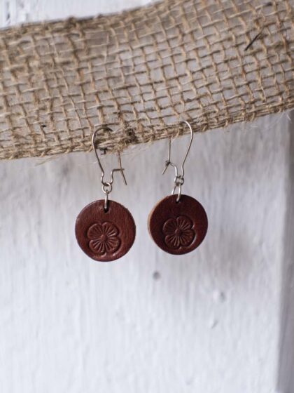 Leather earrings with flower punch.