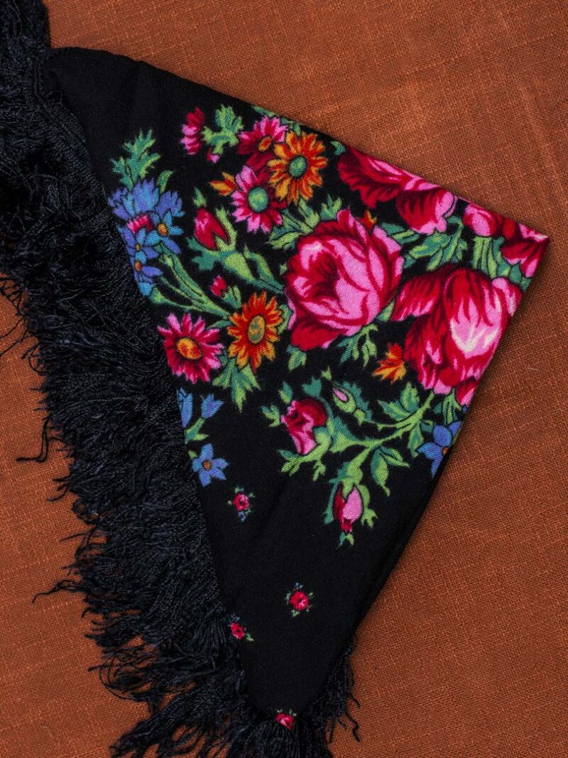 Black scarf with floral pattern.