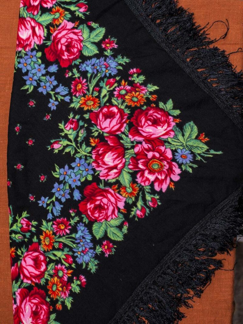 Black scarf with floral pattern.